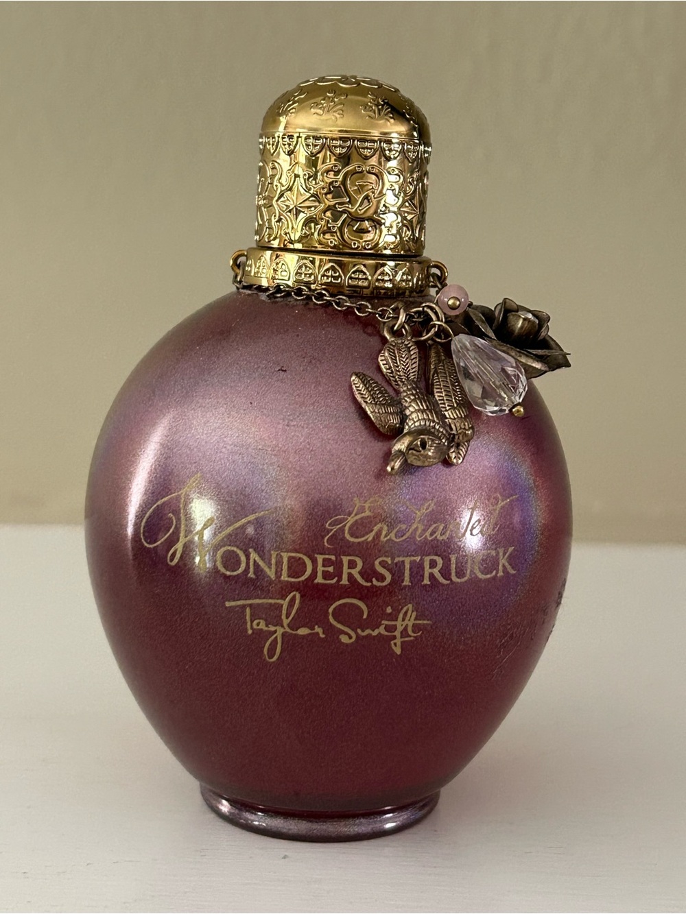Taylor Swift Enchanted Wonderstruck 3.4 fl oz Parfum spray with charms.